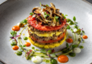 Elegant layered dish with vibrant sauces