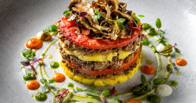 Elegant layered dish with vibrant sauces